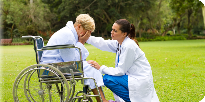 caregiver trying to soothe the elder woman's feelings