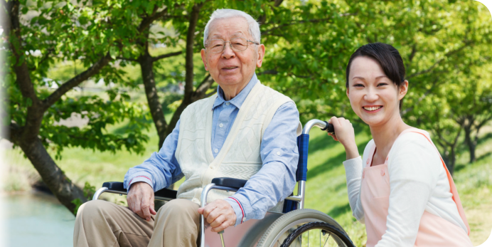 caregiver and the elder man outdoors